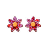 Pink and red holographic confetti flower studs with orange centres side by side on white, front view