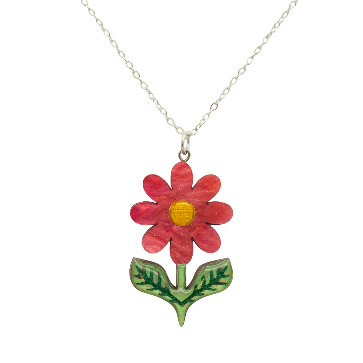 Scarlet red pearlescent acrylic daisy pendant with gold centre and green leaves, on a silver chain, on white
