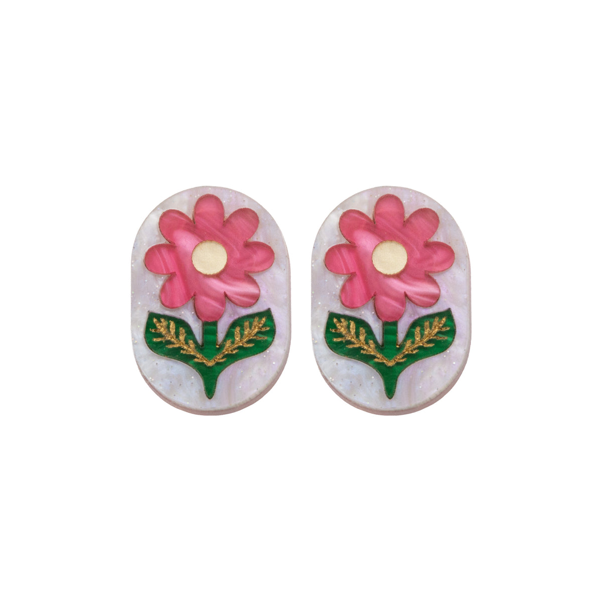 Oval flower stud earrings on a white background, pink blooms with gold centres on pearly white-lilac acrylic