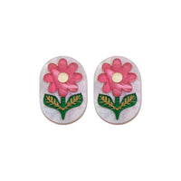 Oval flower stud earrings on a white background, pink blooms with gold centres on pearly white-lilac acrylic