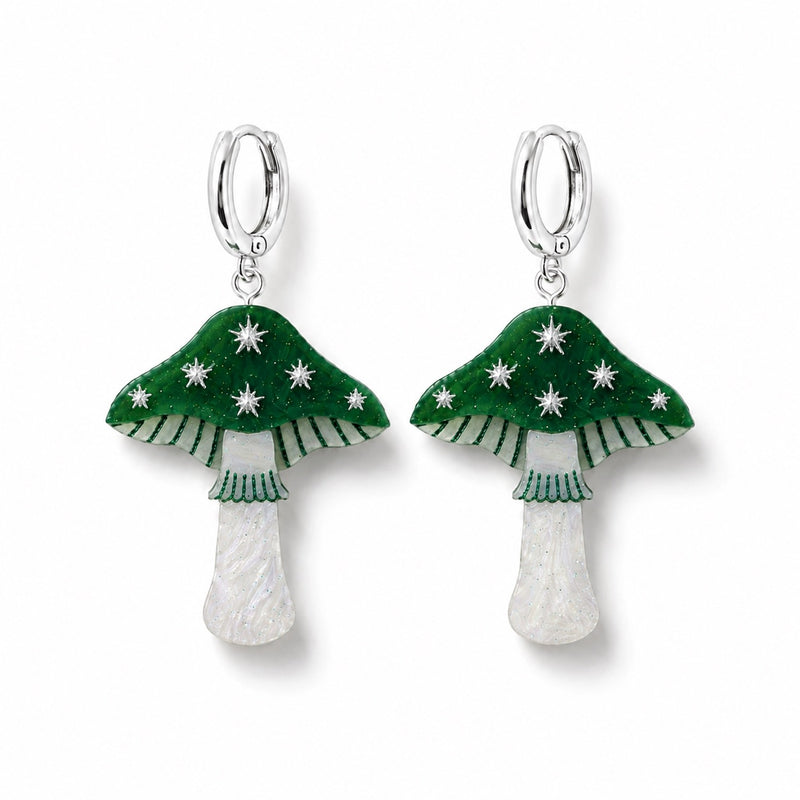 Green toadstool earrings with silver stars, striped gills and pearly white stems on silver huggie hoops