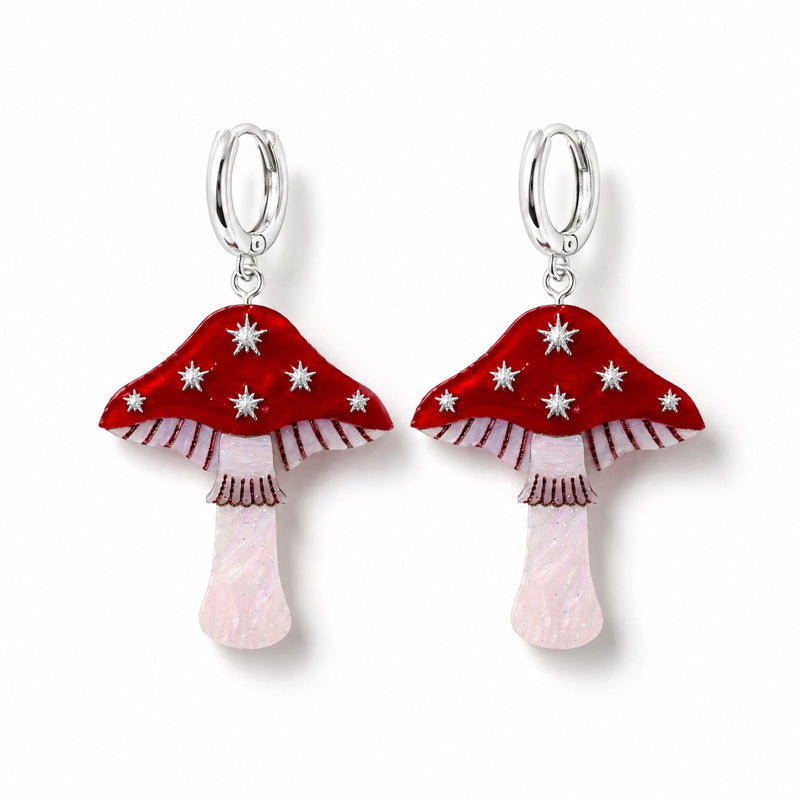 Red toadstool earrings with silver stars, striped gills and pearly pale pink stems on silver huggie hoops